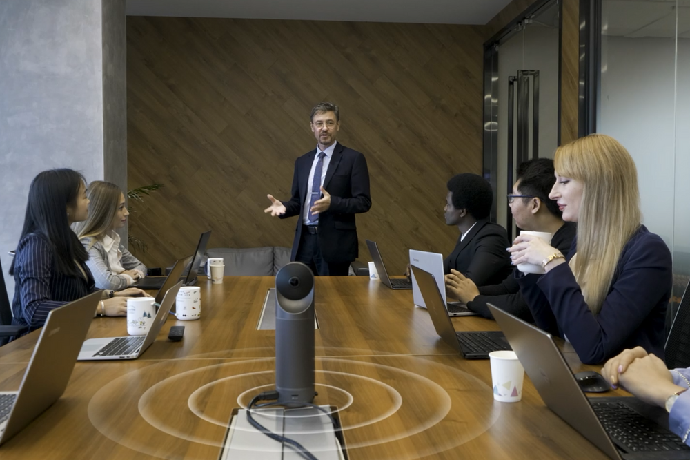 Why Smart Cameras with Speaker Tracking and Auto-Framing are Essential for Room-Based Video Conferencing?